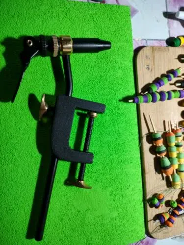Verified buyer photo of the Tailwater vise with a hook locked in the rotating jaw